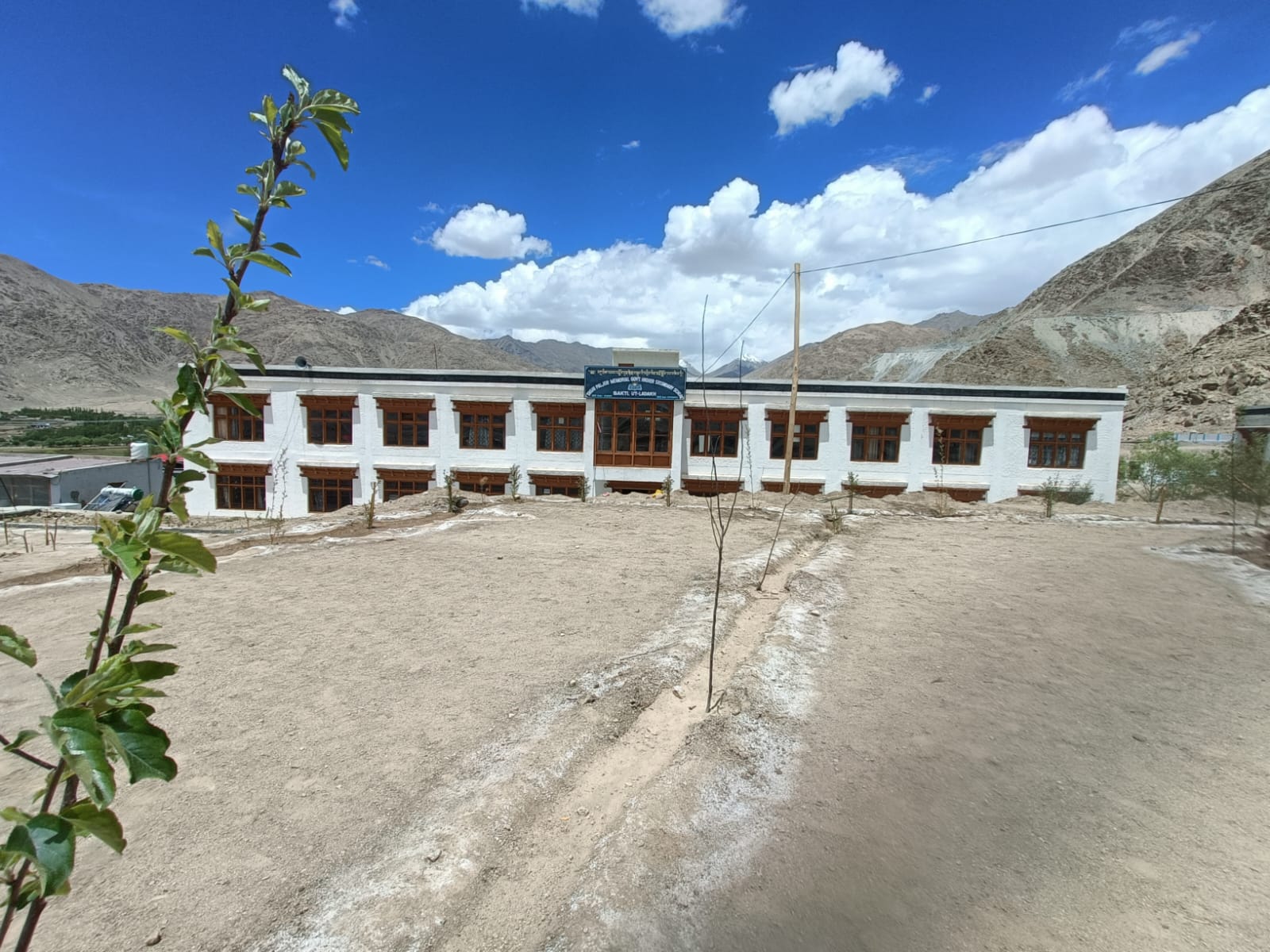 GHSS Sakti school building with Ladakh mountains behind